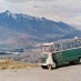 Waitaki Girls Work Out the Effects of Tourism in QueenstownDriver Joan Hamilton poses beside her tourist bus, north of Queenstown, in the early 60's. TeAra Encyclopedia, Alexander Turnbull Library.  